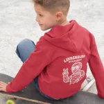 back-of-a-kid-s-pullover-hoodie-mockup-sitting-on-a-skateboard-a9117b